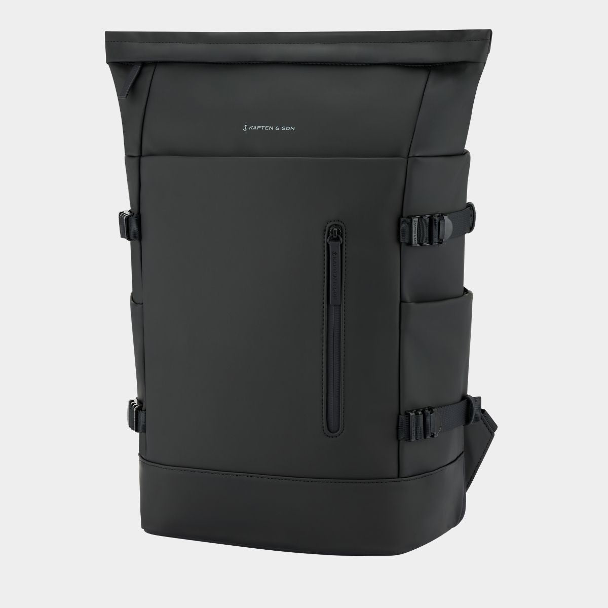 A black backpack with multiple zippered pockets and side buckle straps, shown on a light gray background. The brand name 'KAPTEN & SON' is printed in small white letters on the upper front.