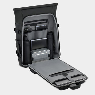 Black and gray backpack with compartments on a gray background