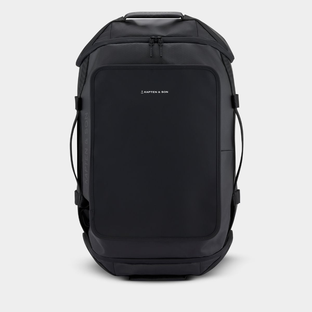 A black Kapten & Son Duffle backpack shown from the front on a light gray background.