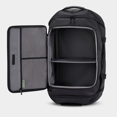 Black backpack duffle bag with open compartment on a  light gray background