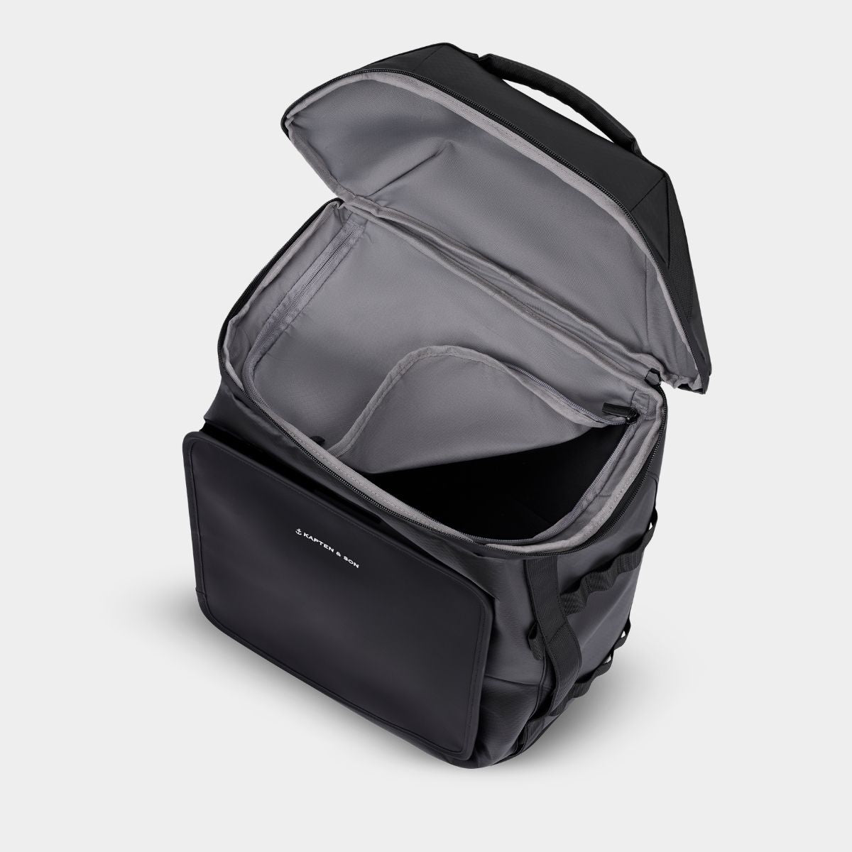 Black backpack with open top compartment on a light grey background