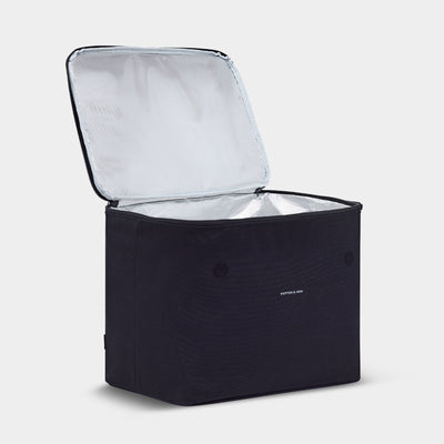 Black soft sides container against. light gray background with "KAPTEN & SON" logo written in white. Open zipper with metallic cooling material.