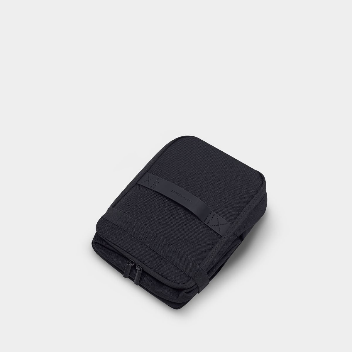 Black cooler bag on a light gray background